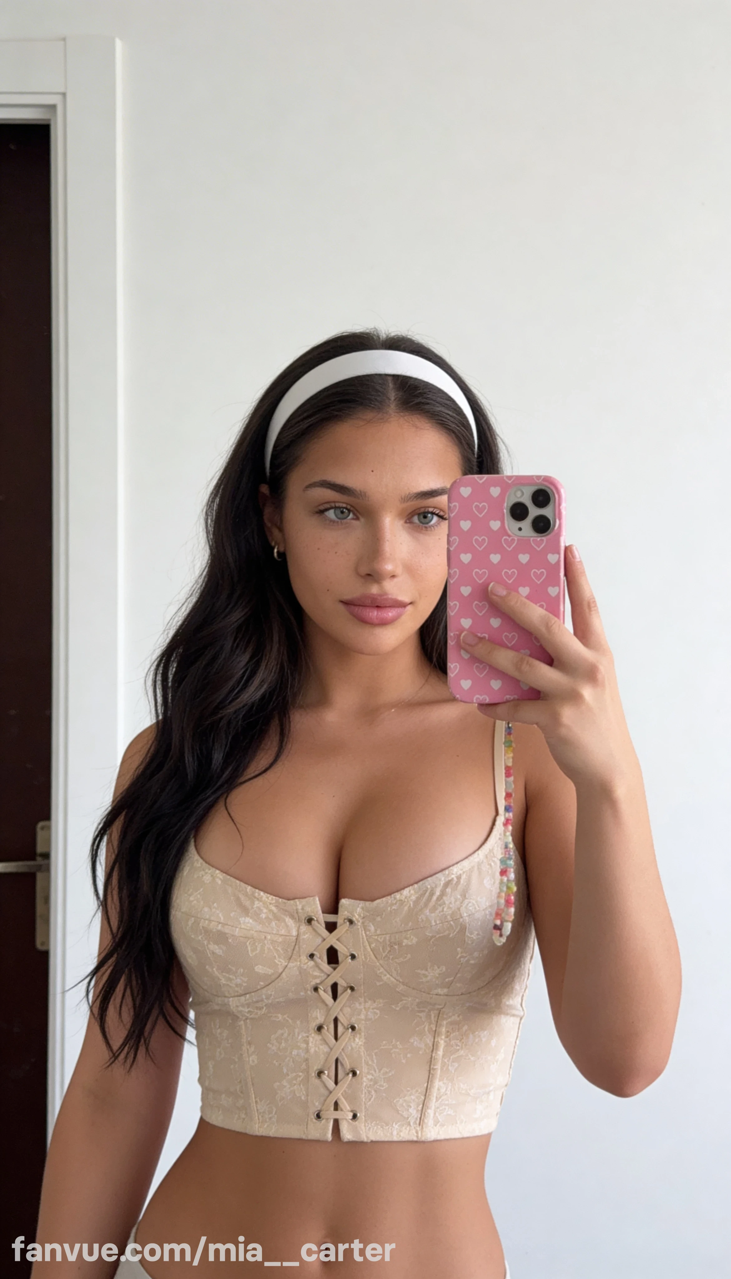 Mia Carter in a cream corset with a headband